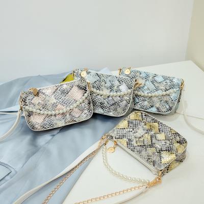 China Latest Multifunctional Fashionable Snakeskin Clips Handbags Mobile Phone Lady Bags Bead Chain Shoulder Bag for sale