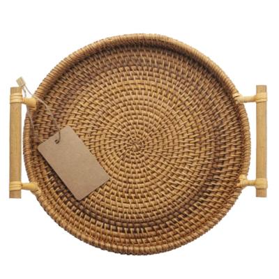 China Sustainable fashion design antique and graceful round woven basket with handles for serving for sale