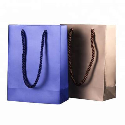 China Custom Logo Recyclable 210gsm Art Paper Shopping Jewelry Packaging Bags In Blue Gold Color for sale