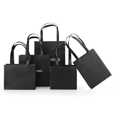 China Luxury Handmade Unique Black Paper Printed Logo Shopping Bag for sale