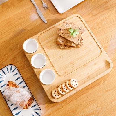 China Sustainable high quality bamboo cheese board with 3 ceramic bowls for gift and wooden cutting board with cheese slicer for sale