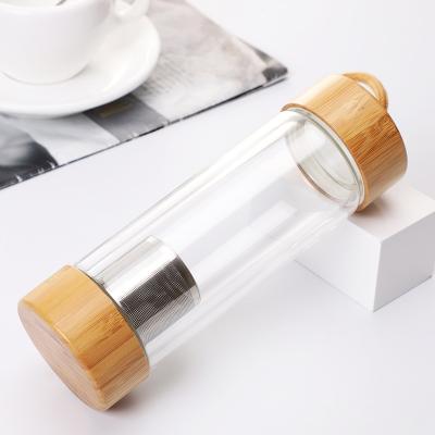 China PORTABLE Wholesale Cheap Portable Bamboo Lid Glass Water Bottles with 300ML and 400ML for sale