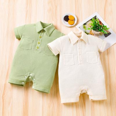 China Super Soft Simple Baby Romper With Pocket And Button Waffle Newborn Baby Clothes Short Sleeve Overalls for sale