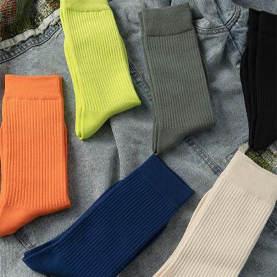 China Viable Style Street Harajuku Socks Fluorescent Solid Color Tube Socks Insti Men And Women Sports Socks Skateboard Cotton Stockings for sale