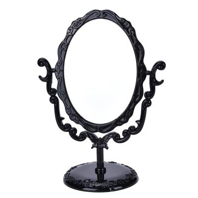 China High Quality Vintage Black Rotating Desktop Butterfly Rose Stand Makeup Mirror Small Gothic Custom Size for sale