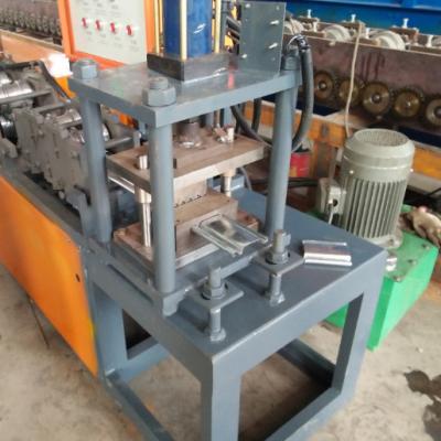 China Building Material Shops High Quality Roll Shutter Door Roll Forming Machine / Roller Shutter / Rolling Slats for sale