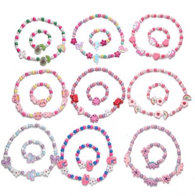 China Cute Customize Charm Character Rainbow Butterfly Cartoon Kids Jewelry Plastic Bracelet Necklace Unicorn Bulk Set for sale