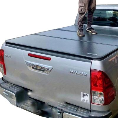 China Tailbox Custom-Fit Pickup Truck Tonneau Covers For Toyota Hilux Aluminum Antioxidation Canopy Triple Truck Bed Protector for sale