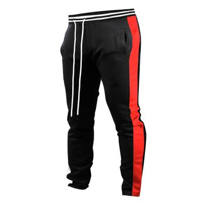 China Autumn anti-pilling elastic waist gym track pants red stripe pants for men drawstring sports track pants for men for sale