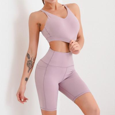 China Breathable Womens 2 Piece Workout Teams Racerback Crop Top High Waist Tummy Control Sports Shorts With Pockets Sets for sale