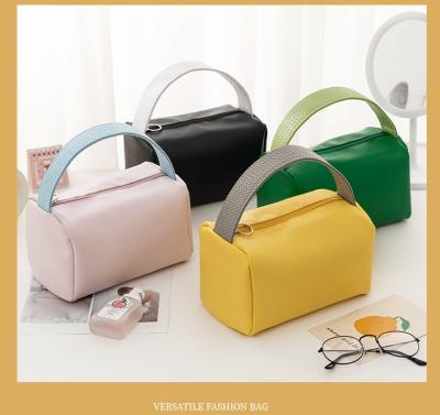 中国 NEW PORTABLE MAKEUP BAG LARGE CAPACITY CANDY COLOR TRAVEL PORTABLE TOILETRY BAG SUNDRIES ORGANIZE MAKEUP STORAGE BAG 販売のため