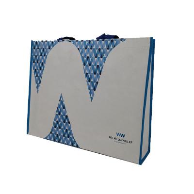 China 100% Eco - Friendly White Paper Shopping Paper Bags Material Logos With Non Woven Interior for sale