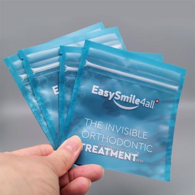 China Orthodontic Barrier Aligner Packaging Zipper Bag Packaging Bag Frosted One Side Clear Matt Mylar Sachet Three Side Seal Zipper Bag for sale