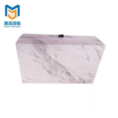 China Handmade Art Paper Cardboard Clamshell Book Shape Custom Packaging Gift Box With Magnet for sale