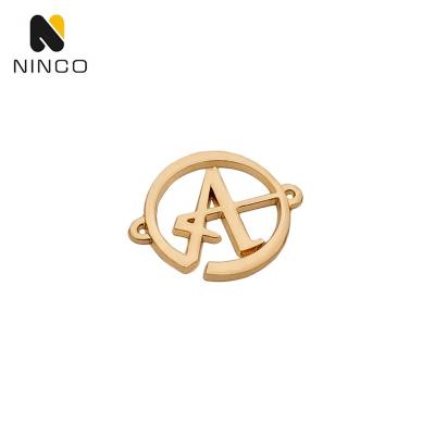 China Sustainable Gold Sewing 2 Holes Cut Custom Embossed Logo Metale Bag +Parts+Clothing Metal Letters Tags Metal Name Plate Brand Labels for sale