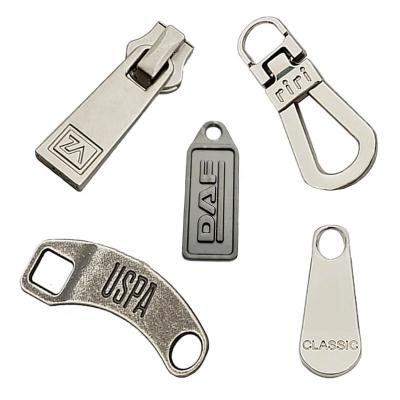 China Custom Made Custom Engraved Zinc Alloy Fashion Apparel Logo Design Zipper Pull Head Metal Zipper Puller Slider Nickel Free For Bag Shoes for sale