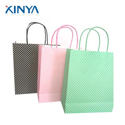 China XINYA Recyclable Private Label Gift Apparel Packaging Cute Paper Bag With Logo for sale