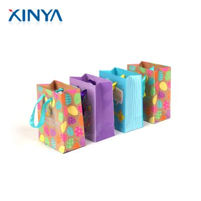 China For Home Use XINYA Custom Promotional Cheap Recycled Paper Small Gift Packaging Bags Wholesale for sale