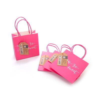 China XINYA Recyclable Wholesale Soft Pink Small Gift Paper Packaging Bags With Handle for sale