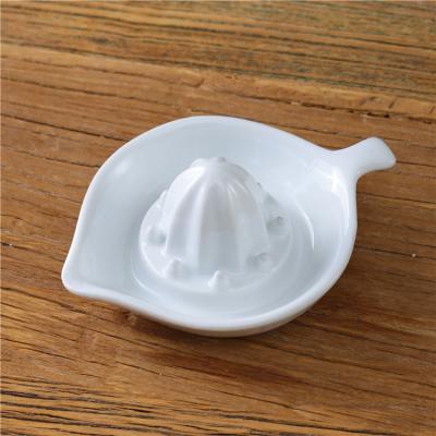 China New Product Home Kitchen Porcelain Stored Convenient White Fruit Juice Lemon Squeezer for sale