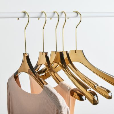 China Custom Plastic Transparent Non-Slip Suit Hangers Durable Tea Color Coat Hangers Space Saving Glitter Gold Metallic Powder Acrylic Hanger for sale