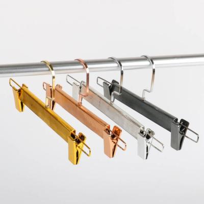 China Durable Custom Household Clothes Store Metal Pants Hangers Cabinet Gold Pants Shows Hanger Skirt Hangers With Clips for sale