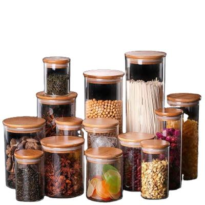 China Bamboo Wooden Cover Storage Jar Seasoning Jar Tea Dried Fruit Glass Stored Heat Resistant Glass Bottle for sale