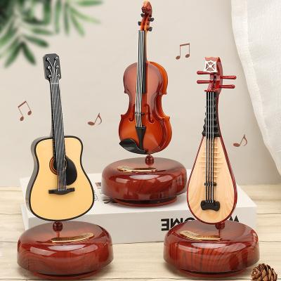 China ABS Music Box Guitar Violin Music Box Birthday Gift Girl Gift Rotating Creative Living Room Decoration for sale