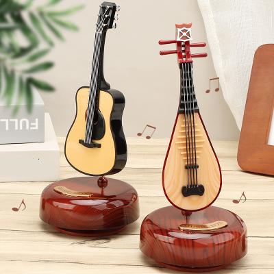 China ABS TOP Selling Music Box Guitar Violin Music Box Birthday Gift Girl Gift Rotating Creative Living Room Decoration for sale