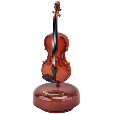 China ABS Most Popular Rotating Musical Box Guitar Violin Music Box Birthday Gift Girl Gift Living Room Creative Decoration for sale