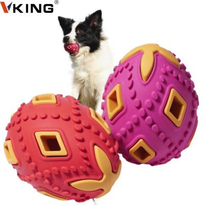 China Durable Durable Natural Rubber Grinding Teeth Dog Chew Toys Two Colors Red With Yellow Color Egg for sale