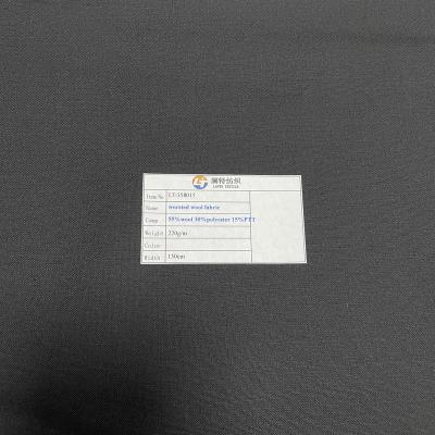 China Plain anti pill black color 55%wool 30%polyester 15%spandex 220g/m wool fabric for pants/tailoring/uniform for sale