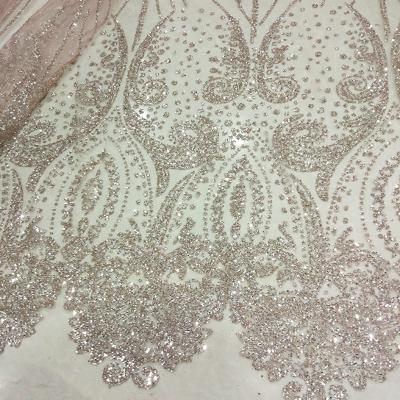 China Viable; Wholesale Nigerian Water Soluble Fabric Gold Lace Sparkle Tulle Sequins African Wedding Dresses Material For Stretch Clothing Lace Trim for sale