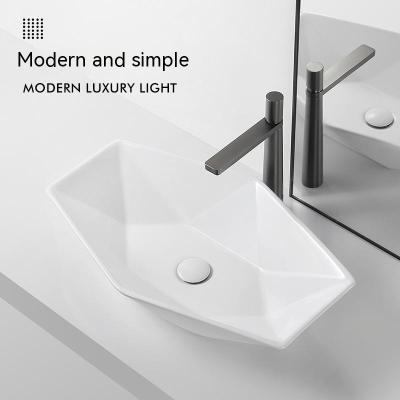 China Modern Hotel Villa Modern simple white wash basin porcelain ceramic countertop Bathroom sink Wash basin diamond cut shape for sale