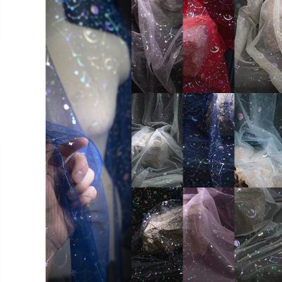 China Breathable In stock sale iridescent foil tulle fabric  constellation design fabric for sale