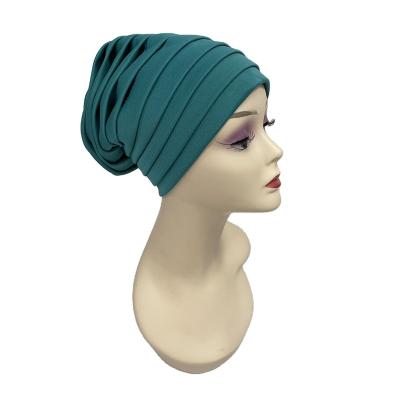 China Amazon Style Fashion Stretch Turban Hat Cotton Cloth Solid Soft Muslim Headwear Hat Inner Hijab for sale