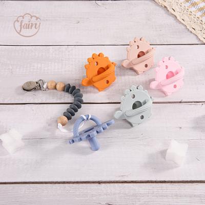 China BPA Free Manufacturer Dinosaur Triceratops Food Grade Silicone Baby Nipple Pacifier for sale