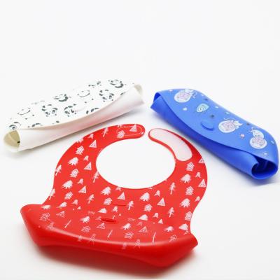 China New Design Washable Printed BPA Free Waterproof Silicone Baby Bib With Food Catcher Wholesale for sale