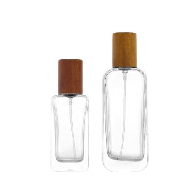 China Wholesale High Qiality Square 30ml 50ml Clear Glass Perfume Bottle With Screw Pump for sale