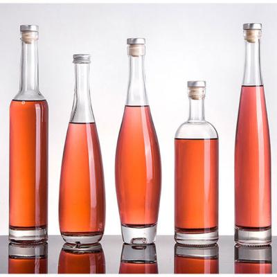 China Lurury Wholesale 200ml 250ml 330ml 375ml 500ml 750ml Clear Glass Wine Bottle With Wooden Cork for sale