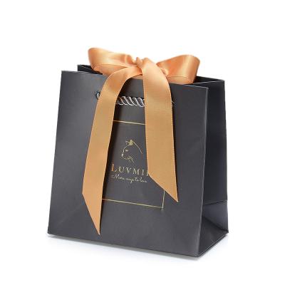 China Personalized luxury eco-friendly brand boutique gift shopping bag customized small size jewelry paper bag with logo for sale