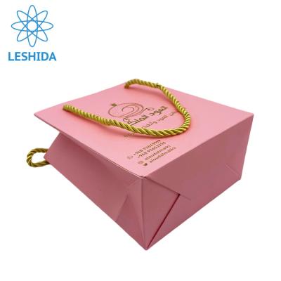 China Recyclable Luxury Color Pink Gift Bag For Jewelry High Quality Pink Paper Bag With Gold Rope Shopping Bags With Gold Logo for sale