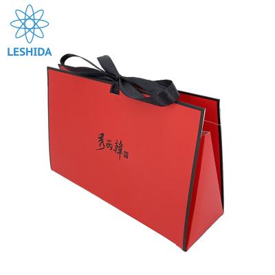 China Factory Recyclable Custom Printed Paper Bag Full Color Printing Shopping Ribbon Handle Matte Lamination Paper Bags for sale