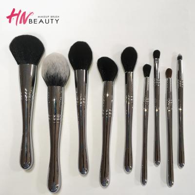 China Angular Blush Vegan 9pcs Shiny Silver Makeup Brush Set For Eyeshadow Base With Custom Bag Pouch for sale