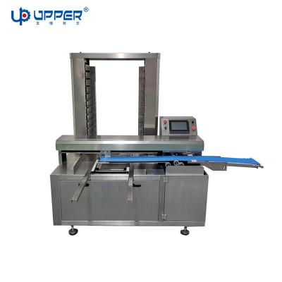 China Automatic dumpling and bakery food tray arranging machine momo arranging tray machine for sale