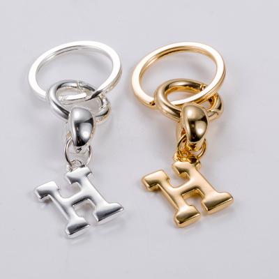 China New Factory Fashion Design Alloy Metal Key Chain Wholesale Gold and Silver Plated Initial Letter Key Chain Unisex Gift for sale