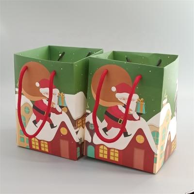 China Recyclable Custom Design Christmas Candy Gift Bags Christmas Eve Paper Packaging Bags for sale