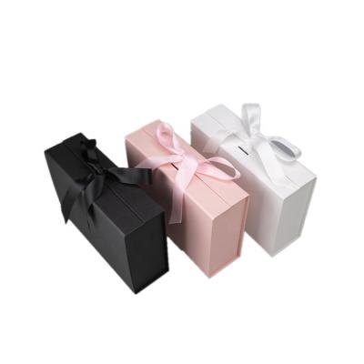 China Recycled Materials Logo Luxury Cardboard Magnetic Folding Custom Gift Box With Ribbon Closure for sale