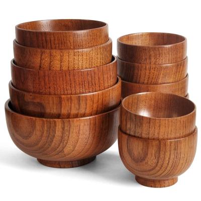 China Eco-Friendly Multi Purpose Solid Round Shaped Wooden Bowl For Salad Fruit Soup Rice Sturdy Acacia Wood Kitchen Utensils for sale