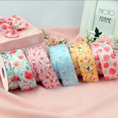 China Viable Wholesale Luxury Cotton Woven Ribbon 40mm 10 25mm Floral Print Polyester Double Sided 50 Yards Ribbons Roll For Hair Bows for sale